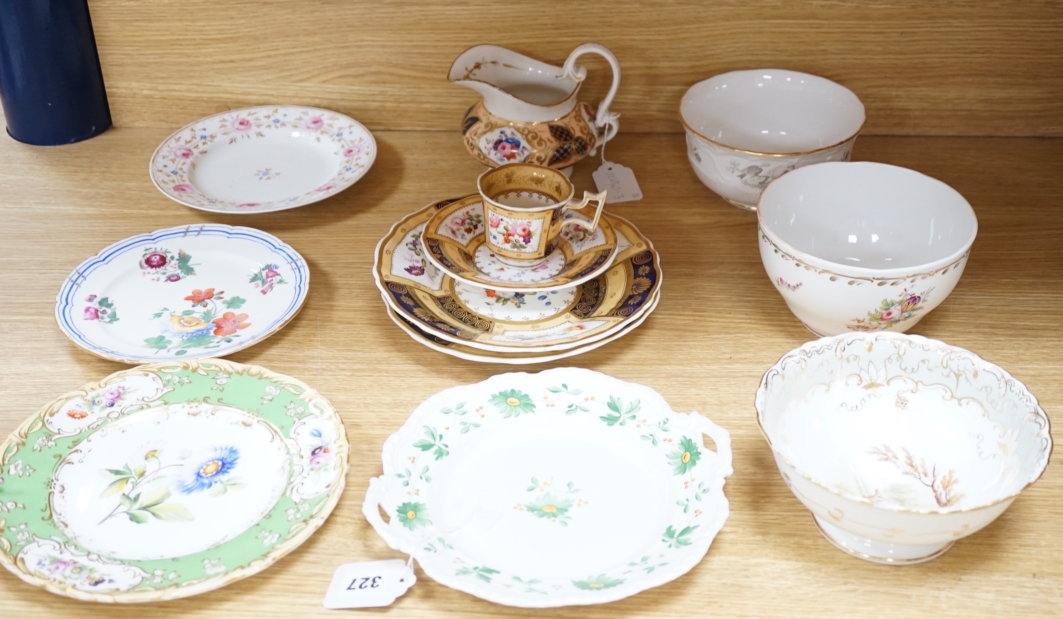 A collection of early 19th century decorative porcelain painted with flowers and a gilt blue ground plus other (12)